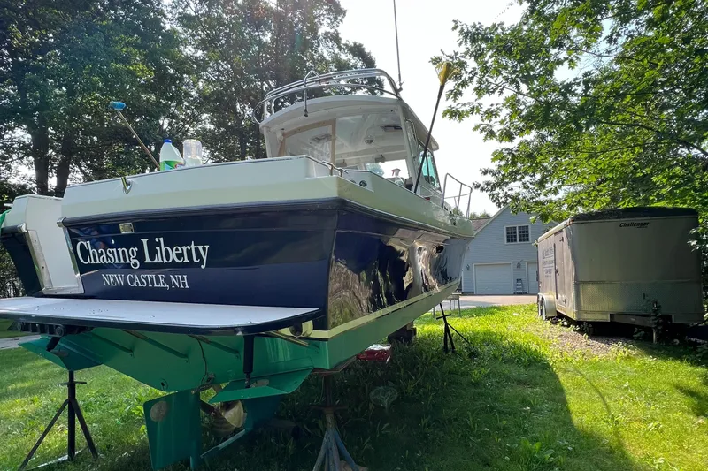 Slide: The Image of 2003 Albin 28 TE Flush Deck boat named "Chasing Liberty" in New Castle, NH, on grass. - 6