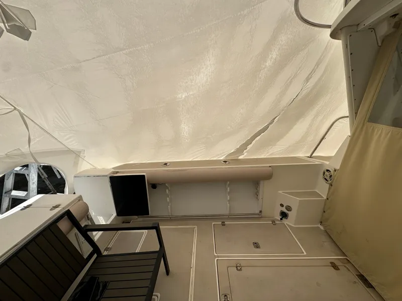 Slide: The Image of 2003 Albin 28 TE Flush Deck boat interior with seating and covered deck. - 9