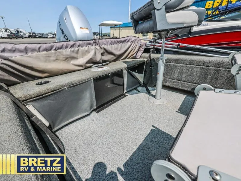 Slide: The Image of 2019 PRO ANGLER 162 boat interior with seating and storage, displayed at Bretz RV & Marine. - 11