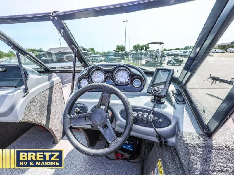 Slide: The Image of 2019 PRO ANGLER 162 boat dashboard with steering wheel and gauges at Bretz RV & Marine. - 9