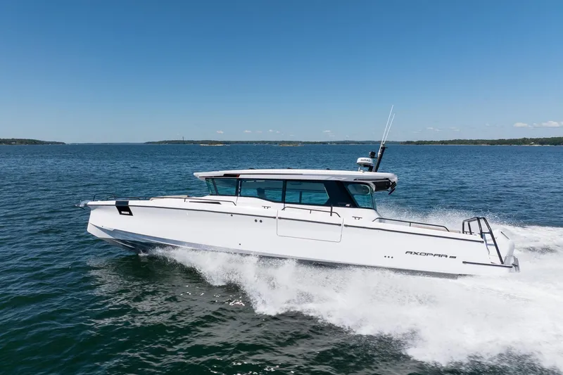 Slide: The Image of Interior of 2025 Axopar 45 boat, featuring modern design and sleek furnishings. - 37