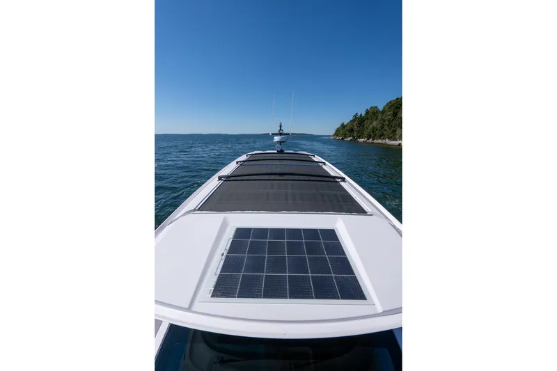 Slide: The Image of Dashboard of 2025 Axopar 45 boat with Simrad display and control buttons. - 46