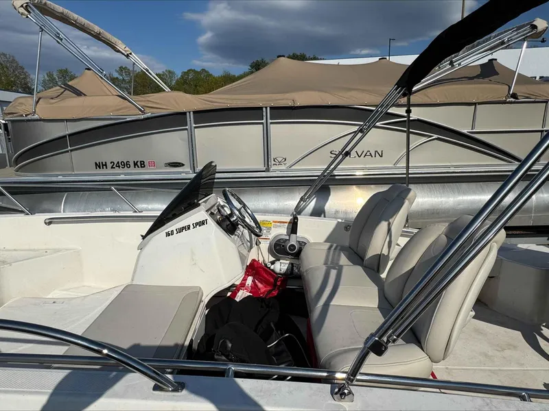 Slide: The Image of 2020 Boston Whaler 160 Sport boat interior with seats and steering console. - 5