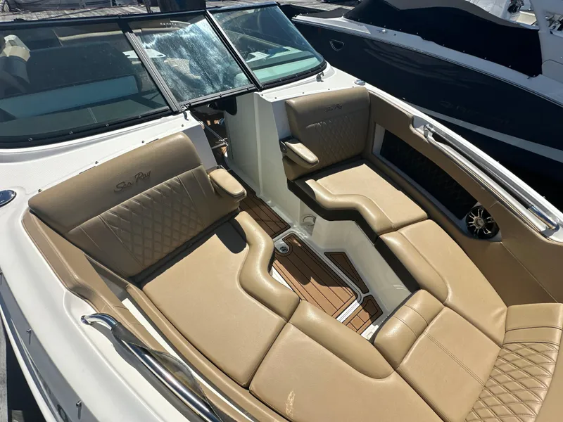 Slide: The Image of 2019 Sea Ray SLX 280 boat with luxurious tan seating and sleek design. - 31