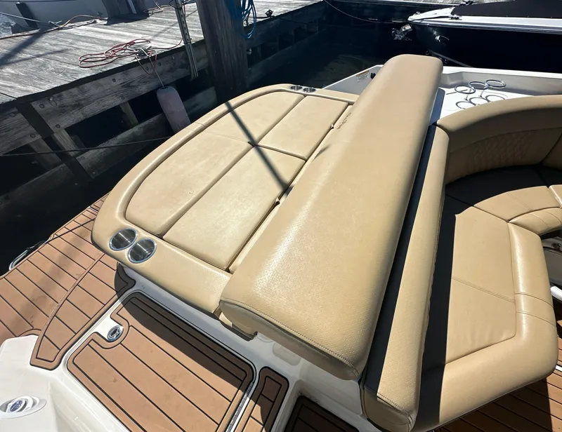 Slide: The Image of 2019 Sea Ray SLX 280 boat with tan leather seating and teak deck. - 36