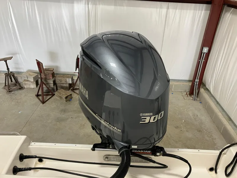Slide: The Image of Yamaha 300 outboard motor on 2021 Robalo R242 Center Console boat. - 10