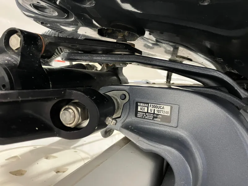 Slide: The Image of Close-up of Yamaha F300UCA engine part on 2021 Robalo R242 Center Console boat. - 11