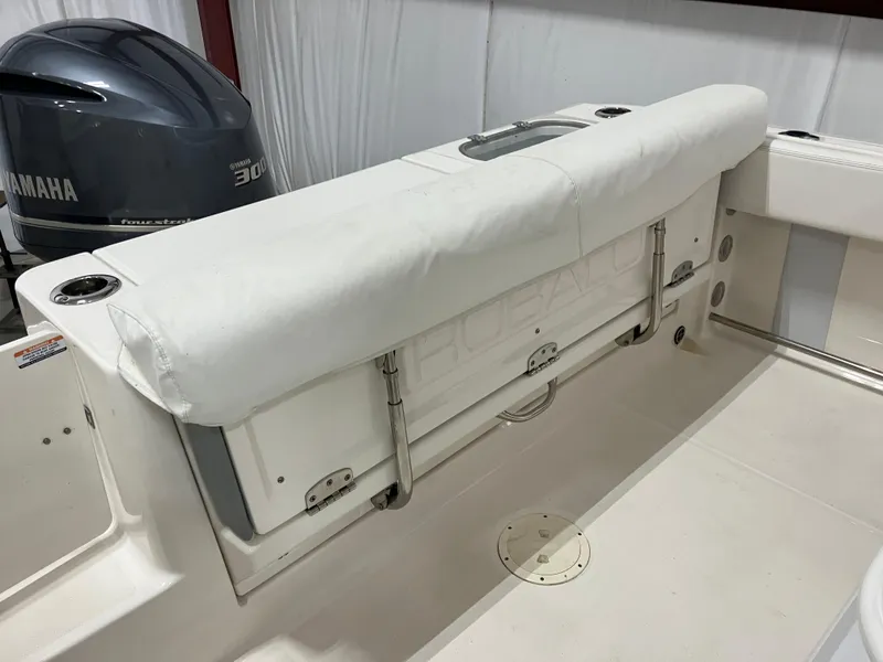 Slide: The Image of 2021 Robalo R242 Center Console boat with Yamaha 300 engine, featuring a cushioned seating area. - 12