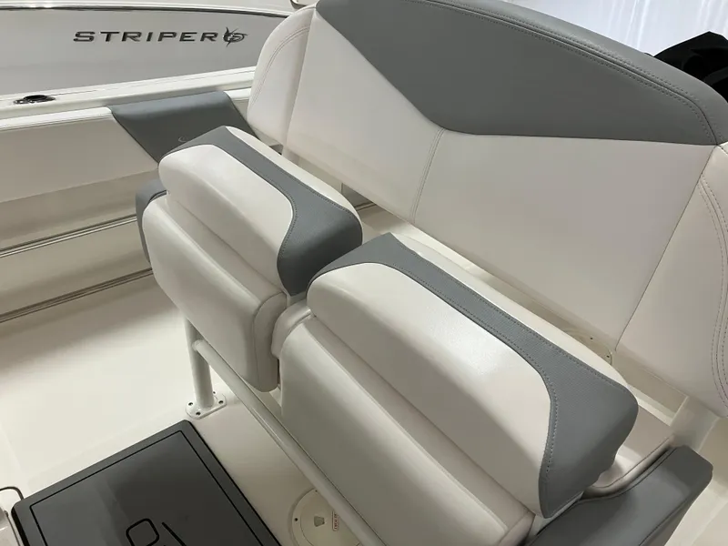 Slide: The Image of 2021 Robalo R242 Center Console boat seating with gray and white upholstery. - 15