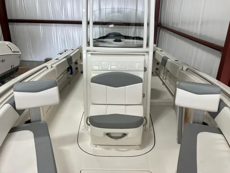 Slide: The Image of 2021 Robalo R242 Center Console boat interior with seating and console. - 17