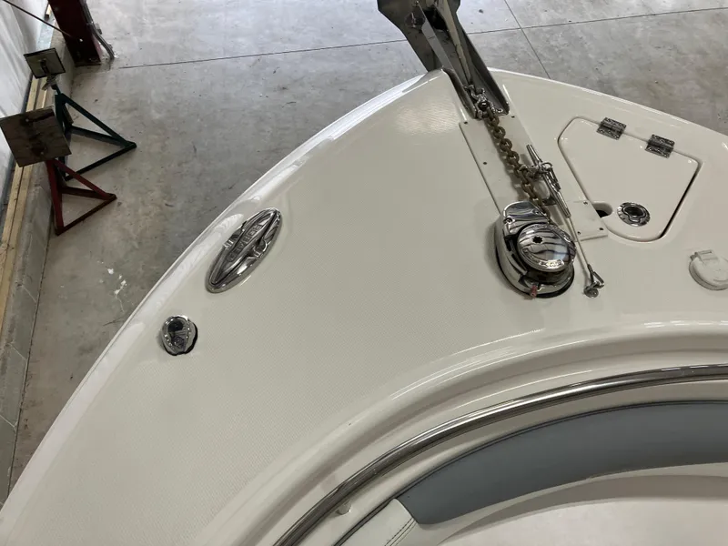 Slide: The Image of 2021 Robalo R242 Center Console boat deck with anchor and fittings. - 21
