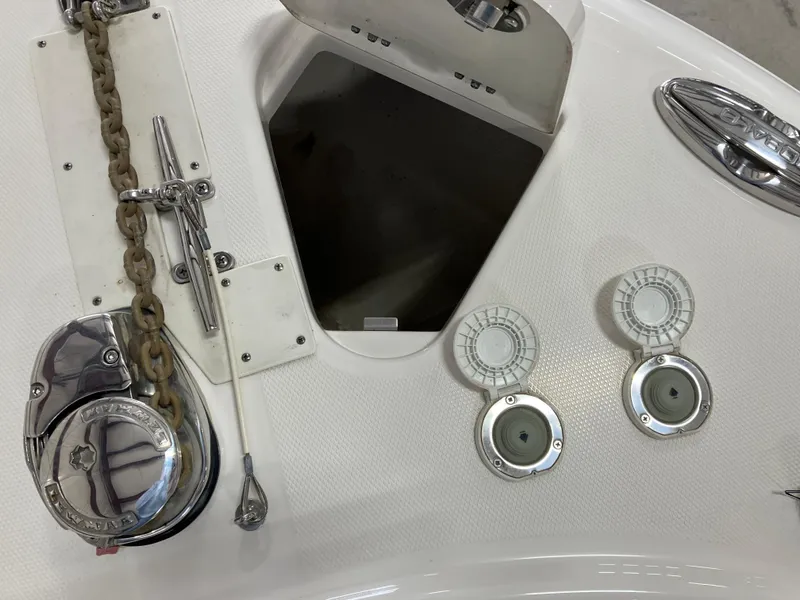 Slide: The Image of 2021 Robalo R242 Center Console boat anchor compartment and fittings. - 22