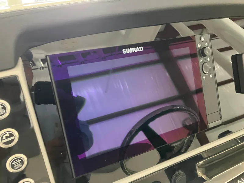 Slide: The Image of Simrad display on 2021 Robalo R242 Center Console boat dashboard. - 24