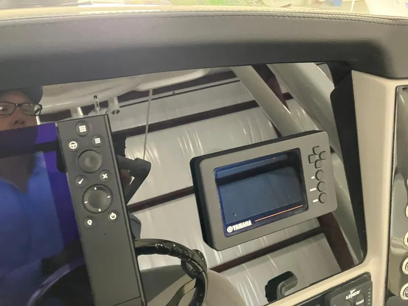 Slide: The Image of 2021 Robalo R242 Center Console dashboard with Yamaha display and controls. - 25