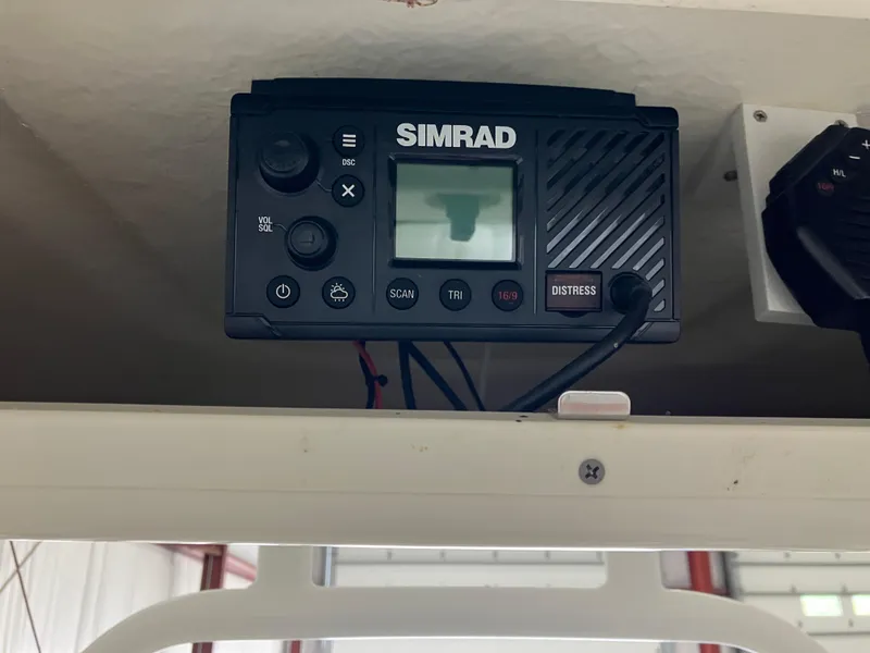 Slide: The Image of Simrad marine radio on 2021 Robalo R242 Center Console boat. - 26