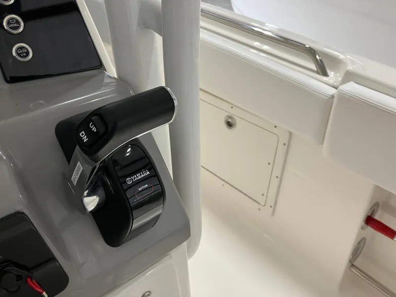 Slide: The Image of 2021 Robalo R242 Center Console boat controls with Yamaha throttle lever. - 27