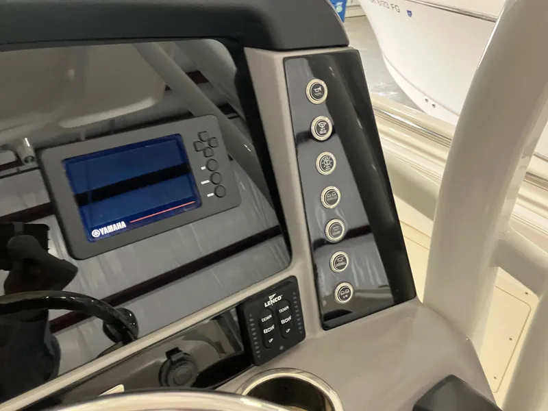 Slide: The Image of 2021 Robalo R242 Center Console dashboard with Yamaha display and control panel. - 28