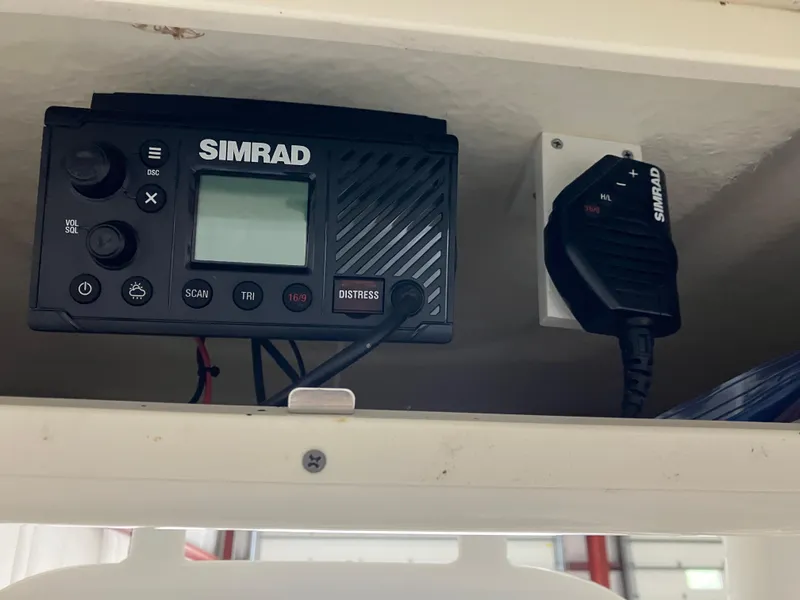 Slide: The Image of Simrad marine radio equipment on 2021 Robalo R242 Center Console boat. - 32