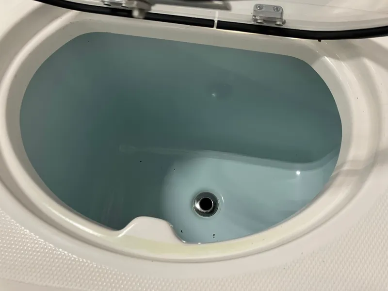 Slide: The Image of Livewell in 2021 Robalo R242 Center Console boat, open lid view. - 34