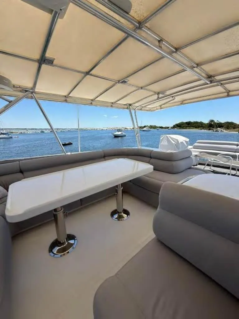 Slide: The Image of Spacious deck of 2000 Horizon E 65 yacht with seating and ocean view. - 18