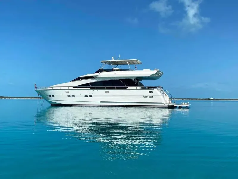 Slide: The Image of Luxury Horizon E 65 yacht from 2000 on calm blue waters under clear sky. - 2