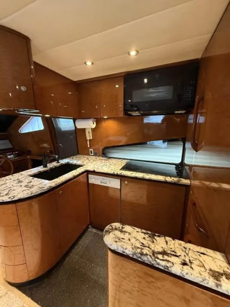 Slide: The Image of Luxurious kitchen in 2000 Horizon E 65 yacht with marble countertops and modern appliances. - 26