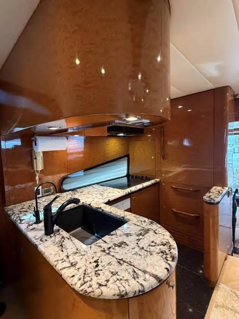 Slide: The Image of Luxurious kitchen in 2000 Horizon E 65 yacht with marble countertops and modern fixtures. - 27