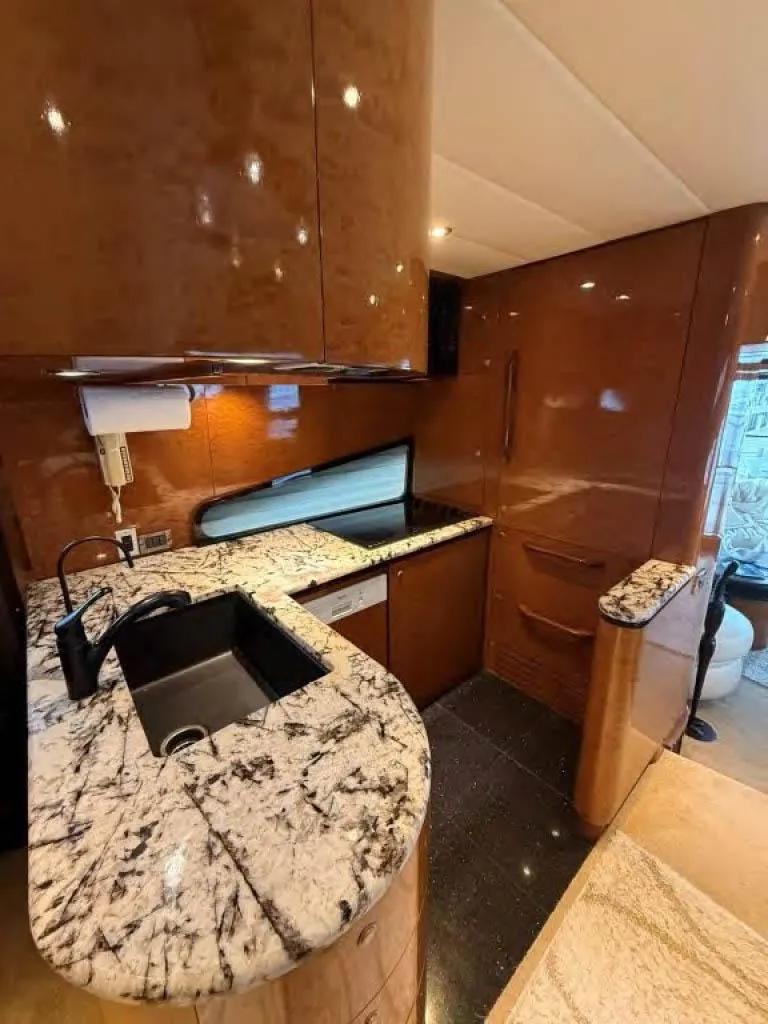 Slide: The Image of Luxurious kitchen interior of 2000 Horizon E 65 yacht with marble countertops. - 28