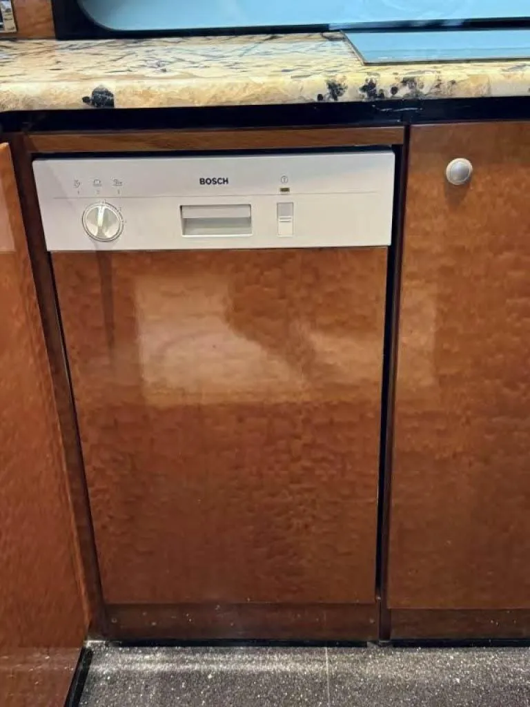 Slide: The Image of Built-in Bosch dishwasher in wooden kitchen cabinet, Horizon E 65, 2000 model. - 30