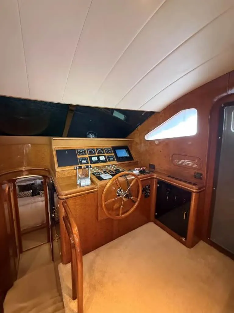 Slide: The Image of Interior of 2000 Horizon E 65 yacht with wooden helm and navigation instruments. - 33