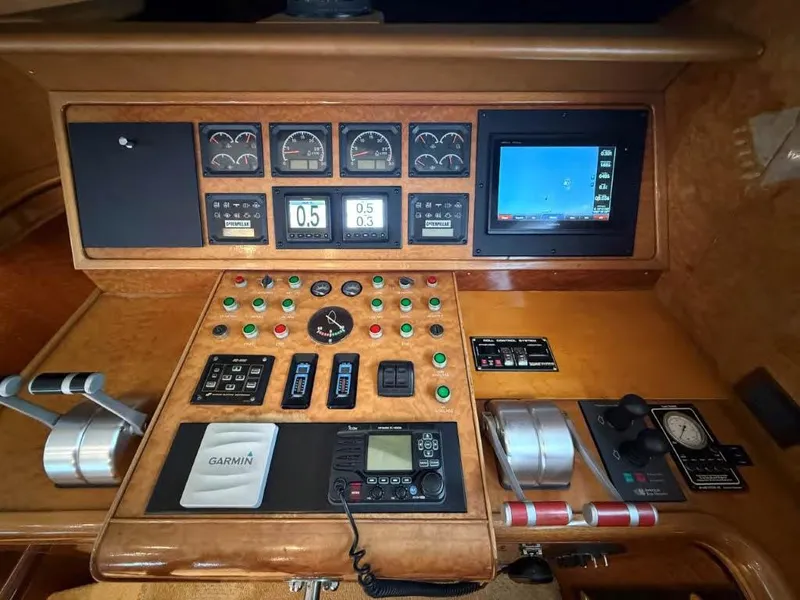 Slide: The Image of Control panel of a 2000 Horizon E 65 yacht with navigation and monitoring instruments. - 34