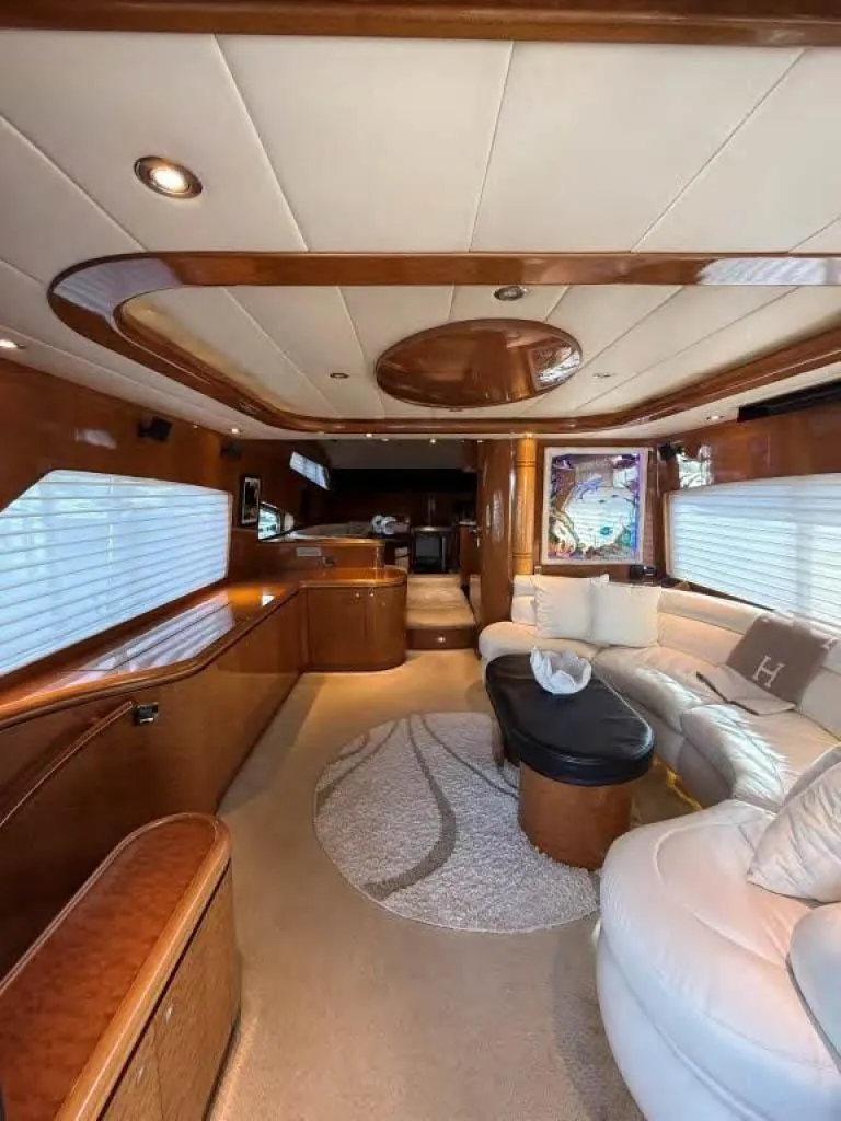 Slide: The Image of Luxurious interior of a 2000 Horizon E 65 yacht with elegant wood finishes and plush seating. - 35