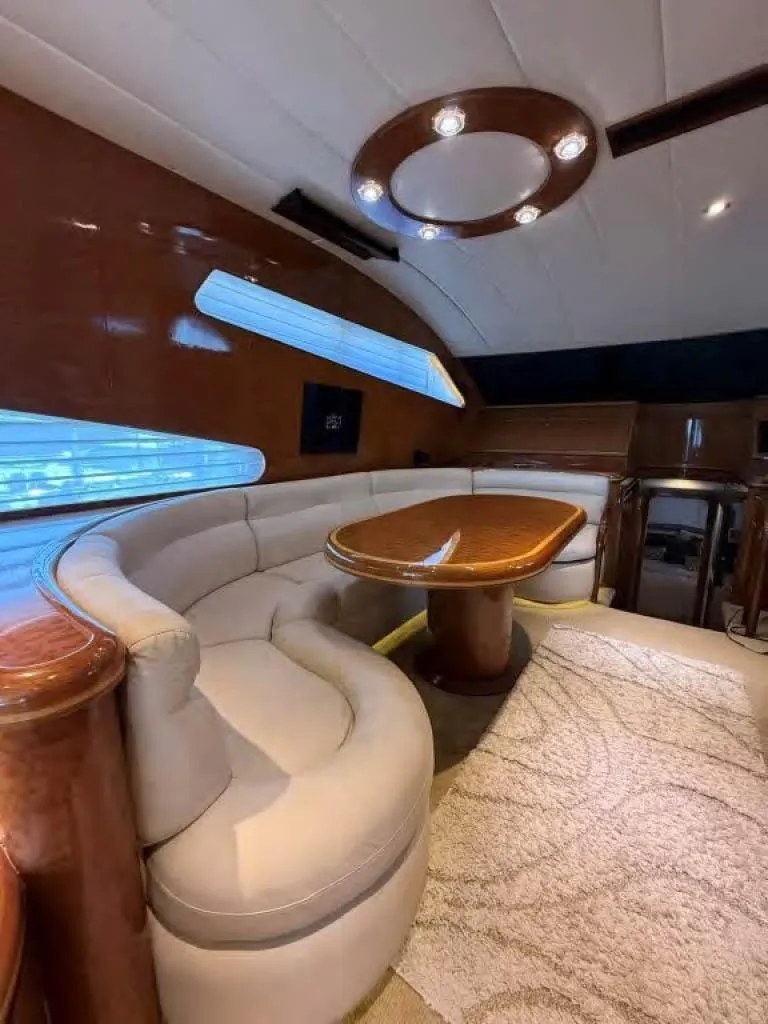 Slide: The Image of Luxurious interior of a 2000 Horizon E 65 yacht with elegant seating and table. - 40
