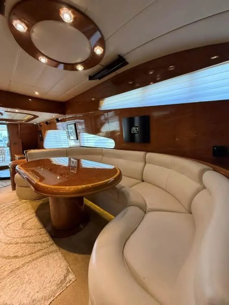 Slide: The Image of Luxurious interior of 2000 Horizon E 65 yacht with elegant seating and wooden accents. - 41
