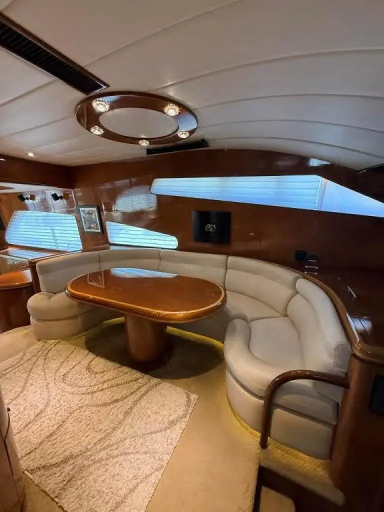 Slide: The Image of Luxurious interior of 2000 Horizon E 65 yacht with elegant seating and wooden accents. - 42