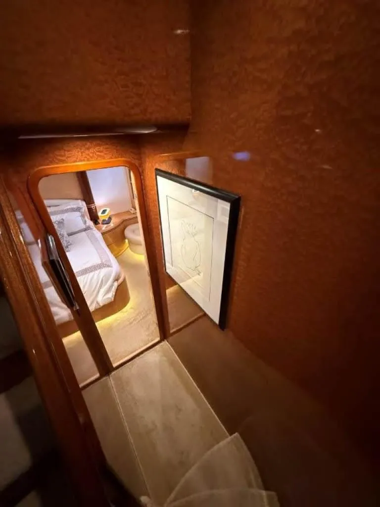 Slide: The Image of Luxurious interior of 2000 Horizon E 65 yacht with elegant wood finish and cozy bedroom. - 43