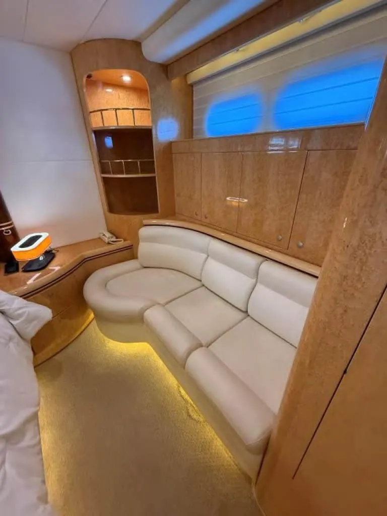 Slide: The Image of Luxurious interior of 2000 Horizon E 65 yacht with elegant wood finishes and plush seating. - 48