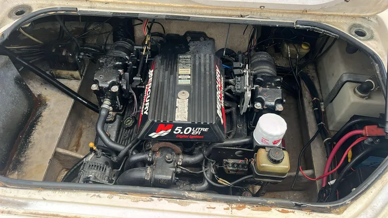 Slide: The Image of Engine compartment of a 2000 Regal Commodore 2460 with a 5.0-liter MerCruiser engine. - 15