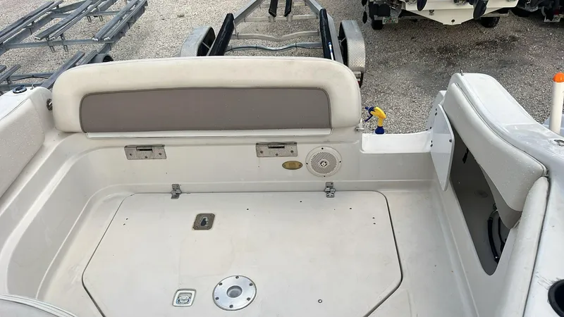 Slide: The Image of Interior of a 2000 Regal Commodore 2460 boat, featuring seating and storage compartments. - 5