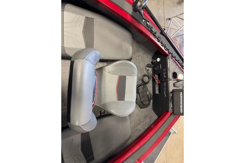 Slide: The Image of 2025 Tracker Targa V-19 Combo boat interior with gray seats and Humminbird electronics. - 14