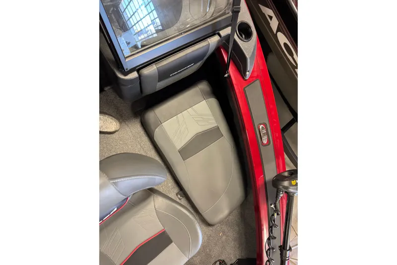 Slide: The Image of 2025 Tracker Targa V-19 Combo interior with gray and red seating. - 16