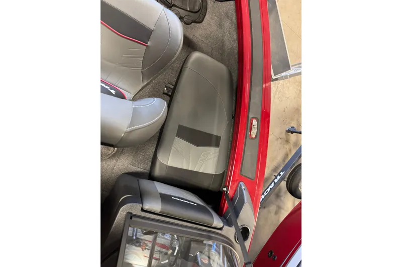 Slide: The Image of 2025 Tracker Targa V-19 Combo interior with gray and red seating, and sleek design. - 18