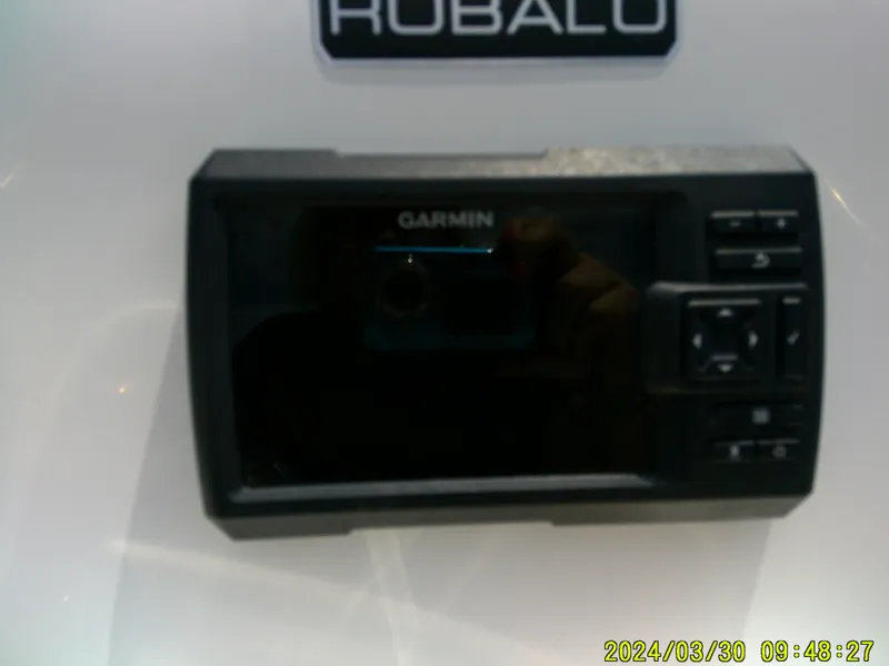 Slide: The Image of Garmin device on 2018 Robalo R160 cc boat dashboard. - 14