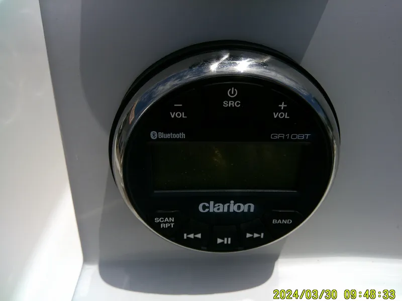 Slide: The Image of Clarion GR10BT audio system on 2018 Robalo R160 cc boat dashboard. - 15