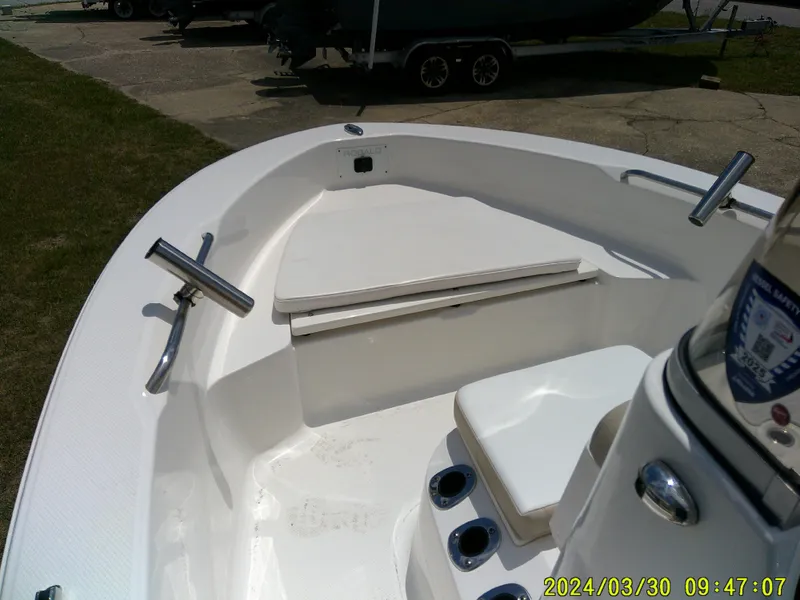 Slide: The Image of 2018 Robalo R160 cc boat interior with seating and stainless steel fittings. - 6