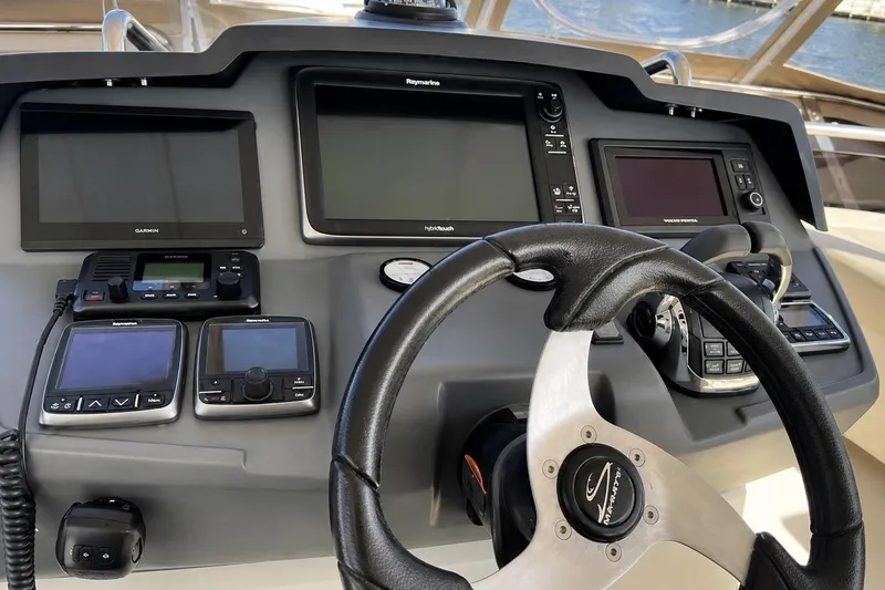Slide: The Image of Control panel of a 2016 Aquila 44 Yacht with navigation and communication equipment. - 8