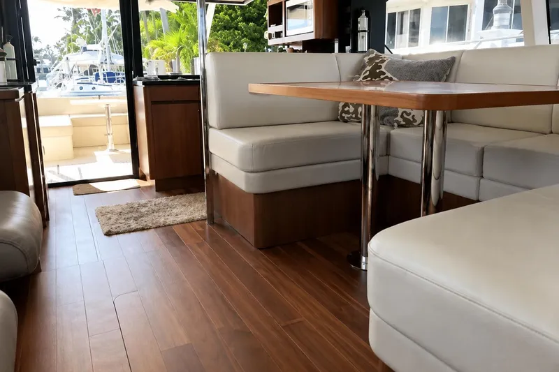Slide: The Image of Luxurious interior of a 2016 Aquila 44 Yacht with elegant seating and wooden flooring. - 11