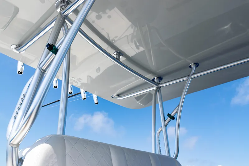 Slide: The Image of 2019 SeaVee 390Z boat with sleek metal framework and white cushioned seating against blue sky. - 11