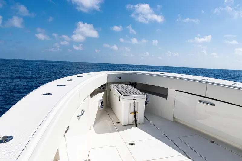 Slide: The Image of 2019 SeaVee 390Z boat deck with ocean view under clear blue sky. - 12