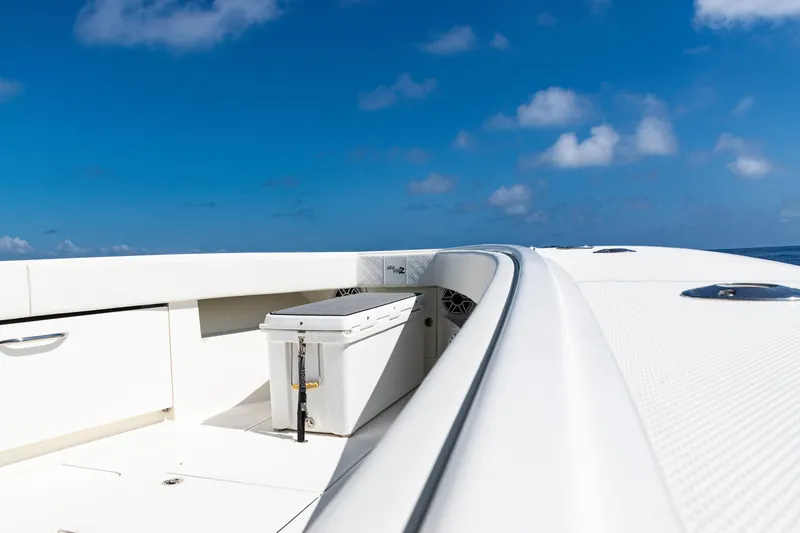 Slide: The Image of 2019 SeaVee 390Z boat deck under clear blue sky. - 13